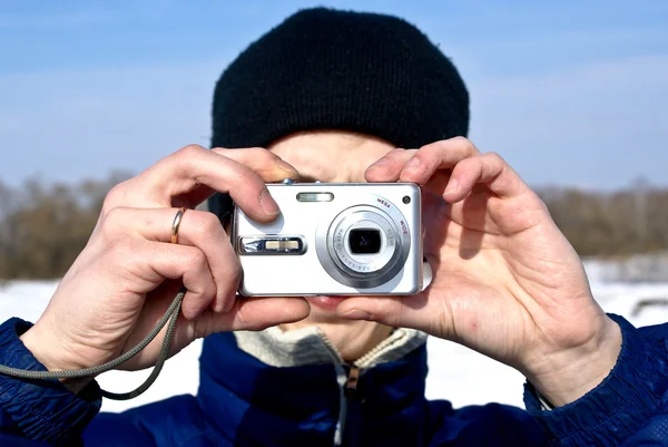 stock image Man with compact camera in winter