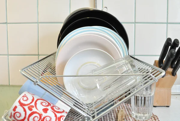 The clean dishes on the rack