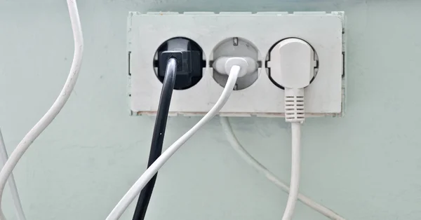 The old socket with three plugs — Stock Photo, Image
