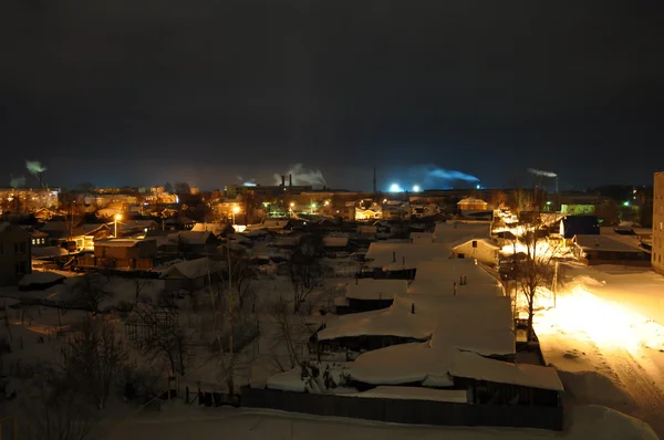 Night Village with smoking chimneys on the horizon — Stock Photo, Image