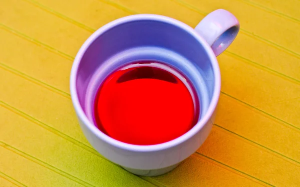 stock image Blue cup with a compote on the green napkin