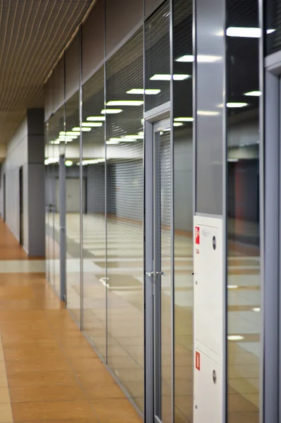 Wall with glass partitions and doors in office building — Stock Photo, Image