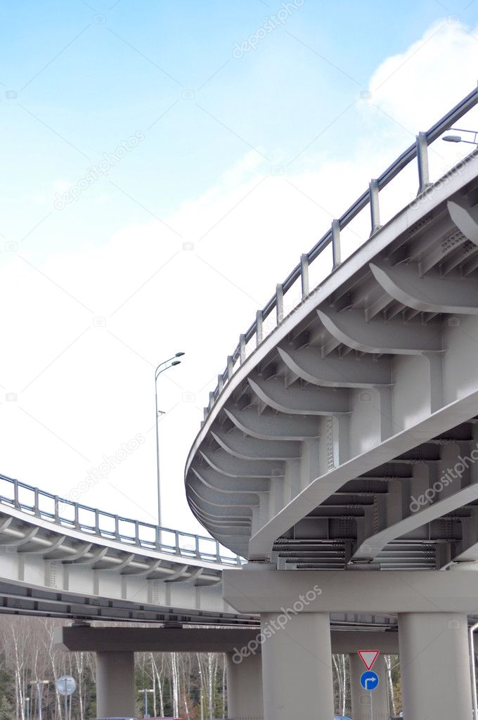 Automobile overpass on background of blue sky with clouds. botto