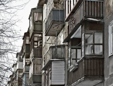 Part of a wall of a building with a number of balconies clipart