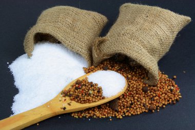 Picture of Spilled Pickling Salt, which is fine grain not iodine sea salt and Pickling Spice, which is mixed from different herbs, from Burlap sacks over cookin clipart