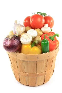 Still picture of different vegetables and ingredients - pepper, potatoes, tomatoes, garlic, onion, mushrooms, Jalapeno in wooden basket bushel over white backg clipart