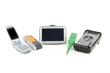 Still life picture of digital gadgets for everyday use - Cell Phone, Dictaphone, GPS, Thermometer, Multimeter, over white background. clipart