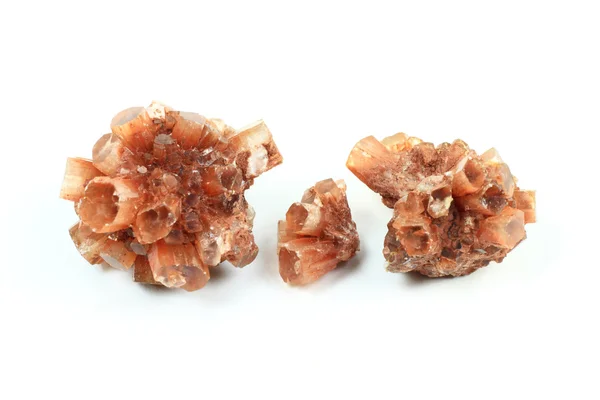 stock image The macro picture of Aragonite or Calcium Carbonate stones over white background. Prismatic Colourful Crystal discover first in Spain and known as gemstone too