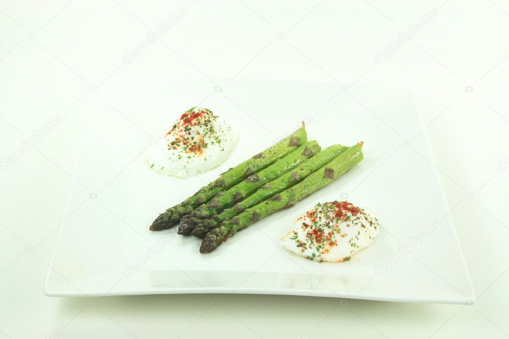 Pictured plate contains Baked Asparagus Spears seasoned with Olive oil, Sea salt, Ground Black Pepper and Poached Eggs seasoned with Paprika, Black Pepper and P