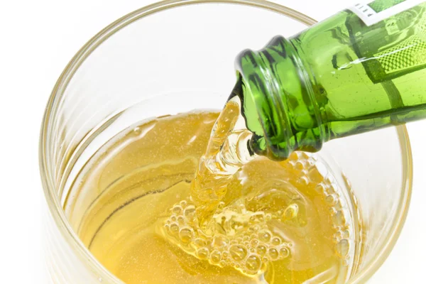 stock image Pouring beer into a glass