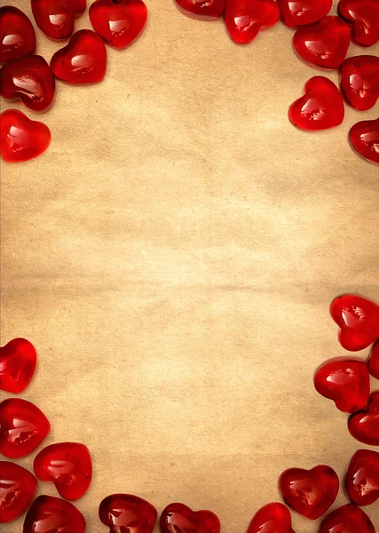 Žlutý papír a červené srdce — Stock fotografie