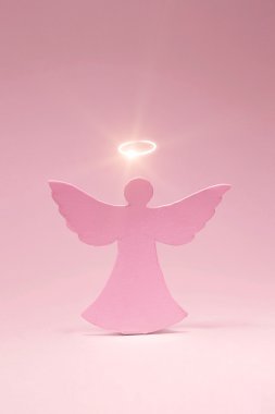 Angel cut out from a cardboard with a shone nimbus clipart