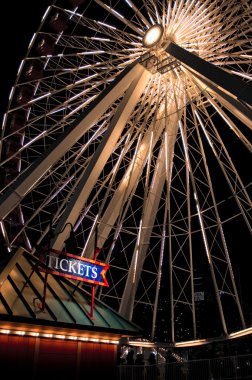 a ticket booth in front of a huge ferris wheel clipart