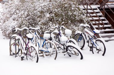 Bikes after the snowstorm. clipart