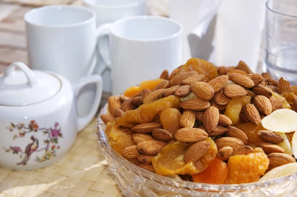 stock image Nuts and dried fruits with a tea set