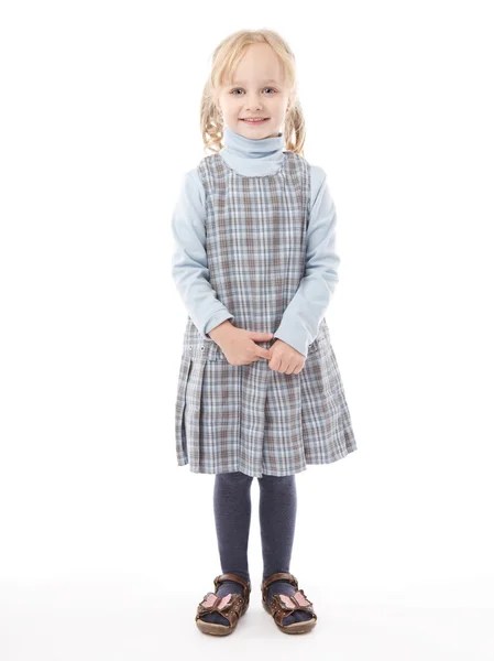 흰색 배경 위에 서 있는 어린 소녀 미소 로열티 프리 스톡 이미지