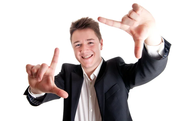 Young businessman framing face — Stock Photo, Image