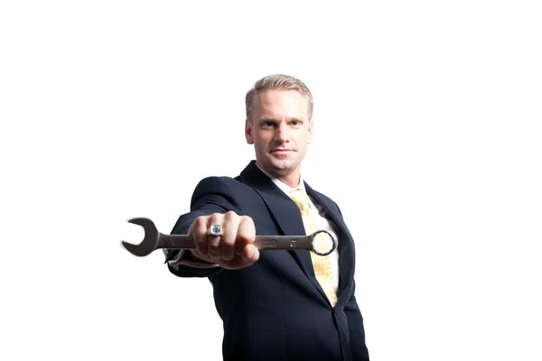 Businessman holding wrench closeup — Stock Photo, Image
