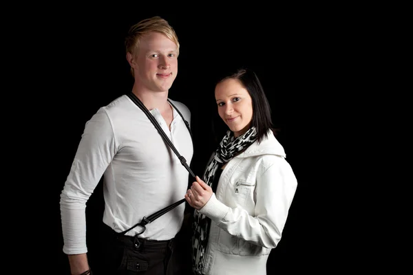 Young couple stretching suspenders — Stock Photo, Image