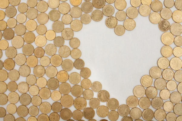 Münzen mit herzförmigem Lehrfeld lizenzfreie Stockbilder