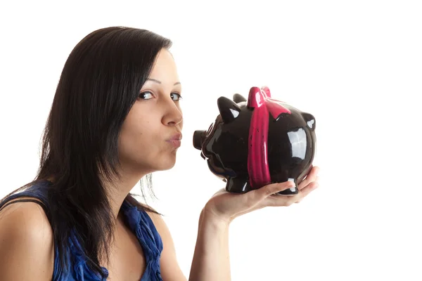 Young woman piggy bank kissing — Stock Photo, Image