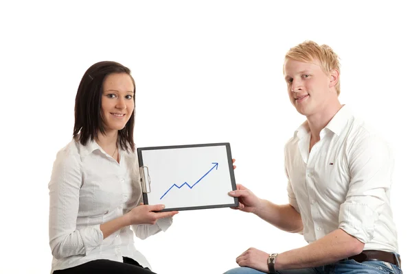 Young businesspeople presenting chart — Stock Photo, Image