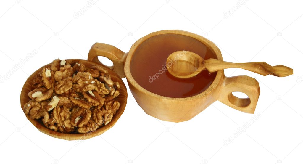 Wooden plates with honey and nuts