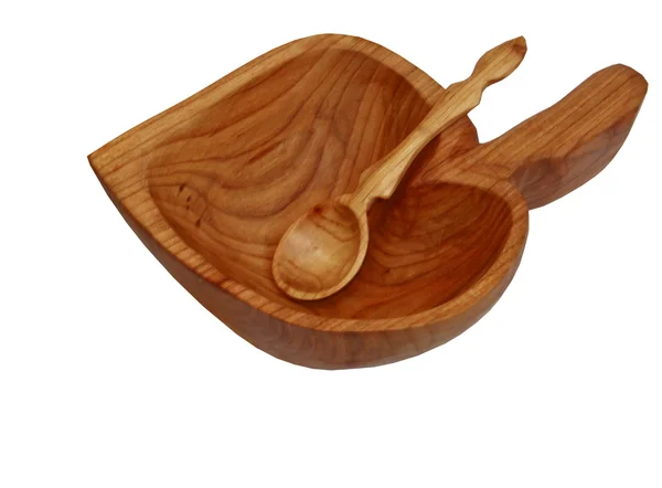 A wooden plate with a spoon in the form of a leaf — Stock Photo, Image