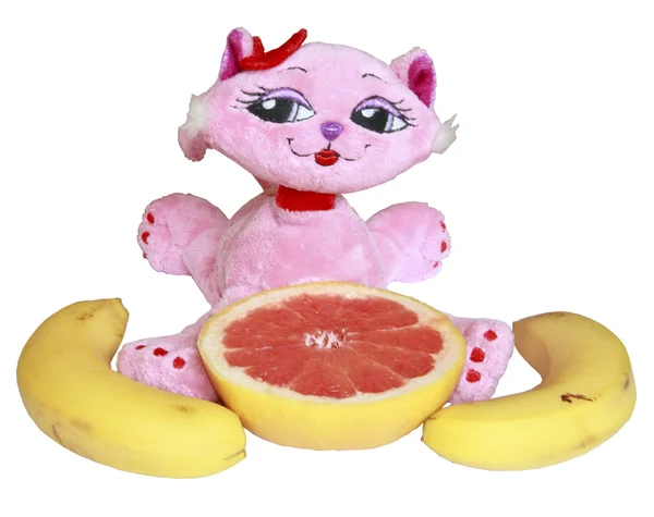 The pink toy cat c bananas and a grapefruit — Stock Photo, Image