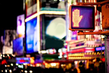 Don't walk New York traffic sign with illuminated and blurred background clipart