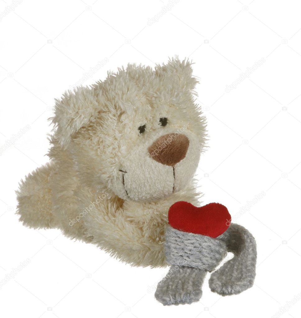 Teddy bear with red heart on white background