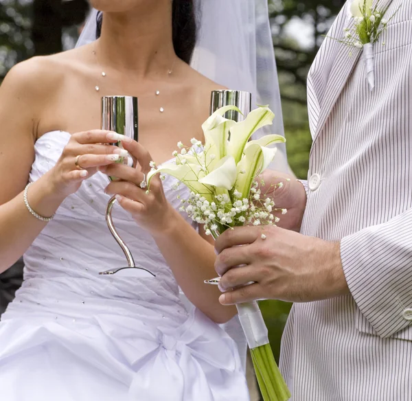 Fiance and bride keep steel glass — Stock Photo, Image