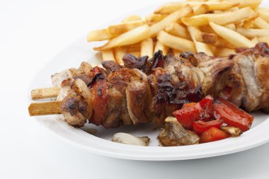 Meat on skewers served with french fries, Zwei Fleischspieße mit Pommes clipart