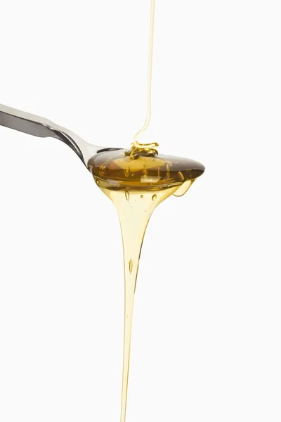 stock image Honey dripping, Honig auf Löffel