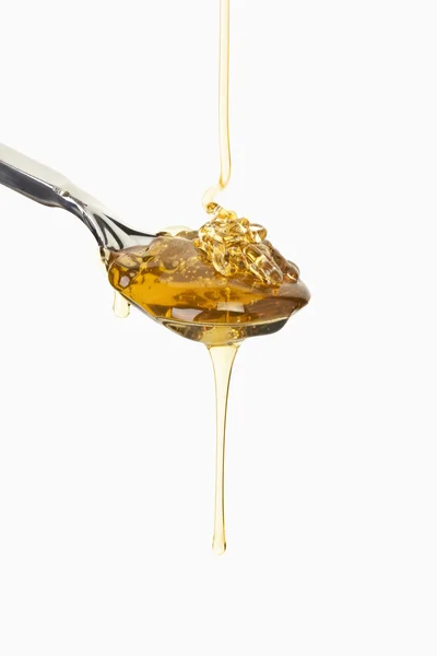 stock image Honey dripping, Honig auf Löffel