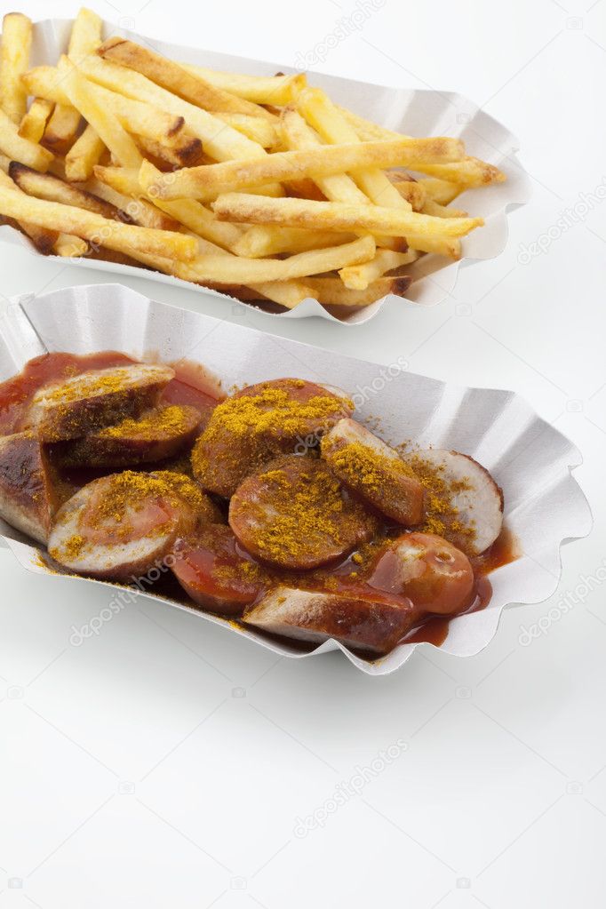 A caurried sausage with french fries, Eine angerichtete Currywurst mit Pommes