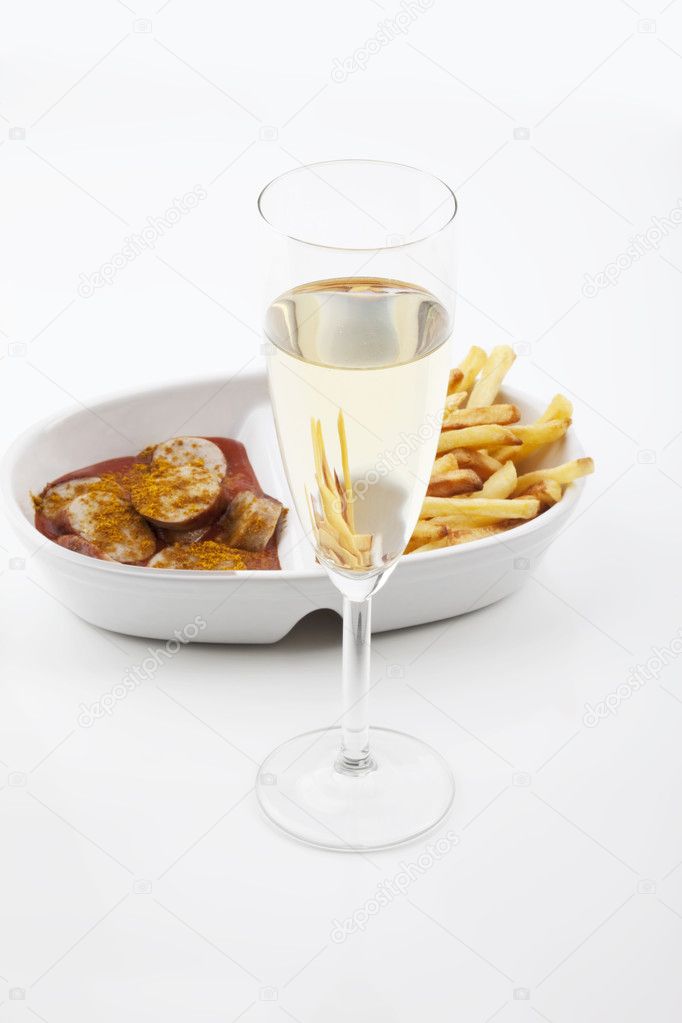 Currywurst curried sausage with french fries and prosecco