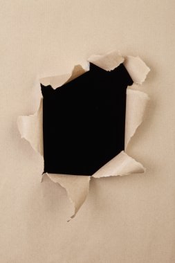 Schwarzes Loch in einem durch krafteinwirkung zerstörtem Papier, black hole in a destroyed paper