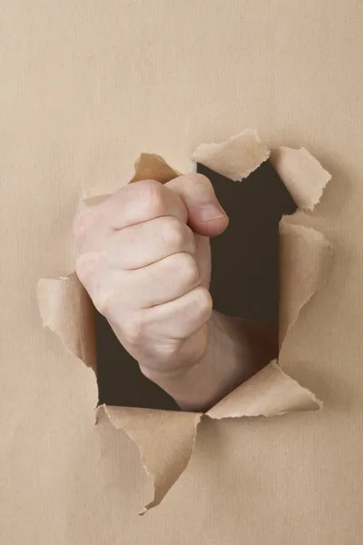 Eine Faust Durchschlägt Eine Papierwand Fist Breaks Paper Wall — Stock Photo, Image