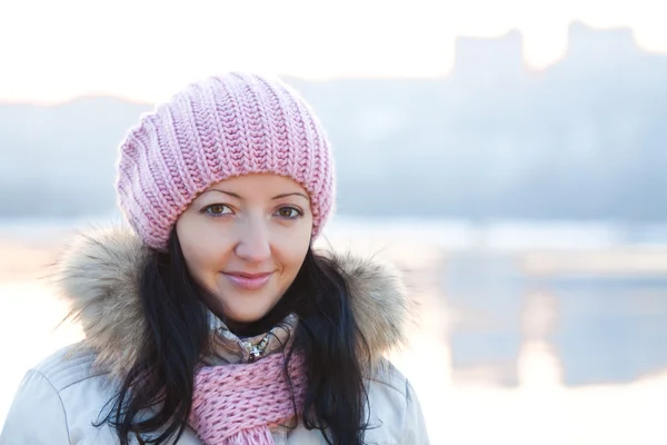 stock image Positive smiling girl in winter clothes on sunset