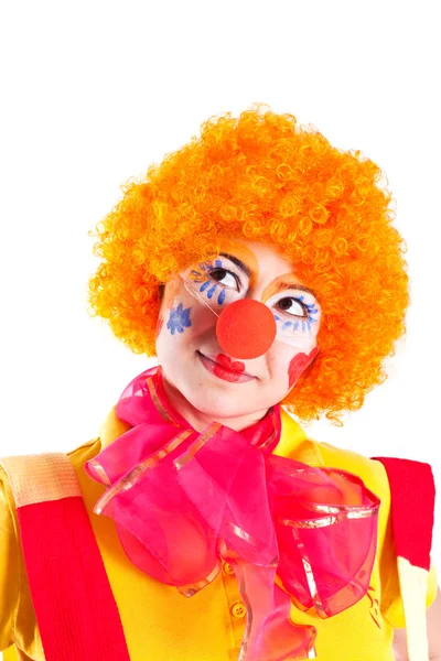 En flicka klädd som en clown söker — Stockfoto