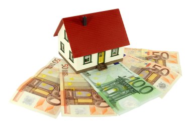 A model of a house is situated on Euro notes clipart