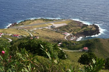 Saba island in the Caribbean with its airport and the shortest runway in the world clipart