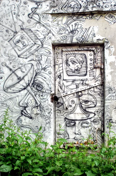 Graffiti on doors and wall — Stock Photo, Image