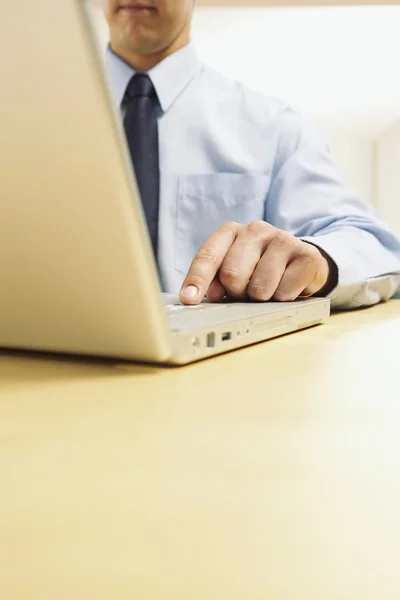 stock image The businessman works at the computer