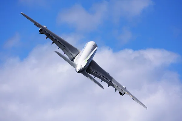 stock image Passanger airliner flight over a cloud covered background