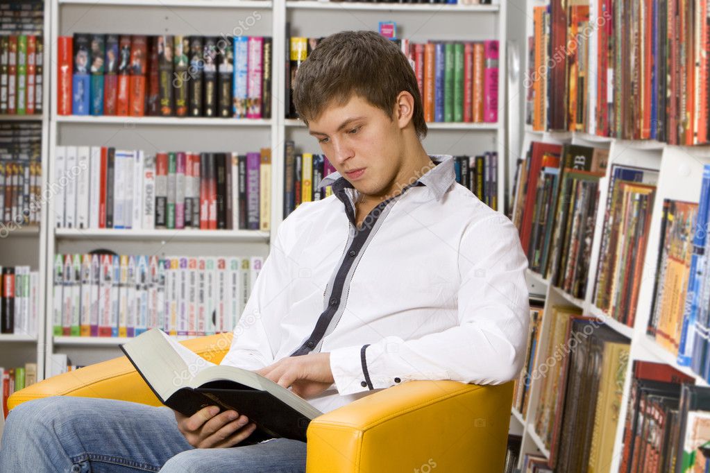 Young man reading book