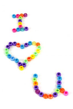 Colored beads spell I heart you. clipart