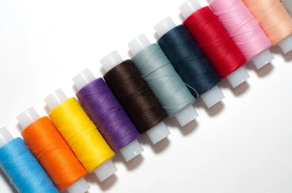 stock image Group of multicolored sewing threads