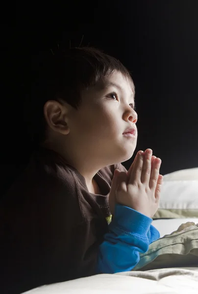 Saying his prayers before bed. — Stock Photo, Image